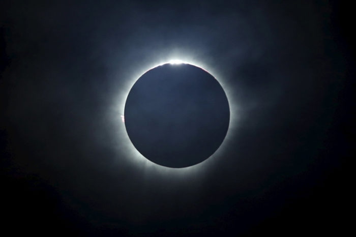 A total solar eclipse is seen from the beach on Ternate island, Indonesia, March 9, 2016. REUTERS/Beawiharta