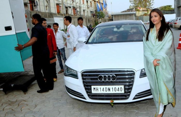 Aishwarya Rai Bachchan snapped posing with her Audi A8 car at the National Sports Club of India in Mumbai on April 27, 2014. (Photo: IANS)